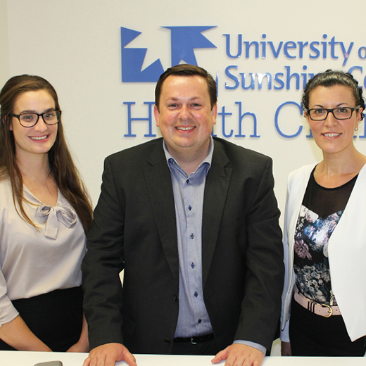 USC Clinical Trials Centre Director Lucas Litewka, centre, with staff members Claire Le Bris, left, and Georgie Street.