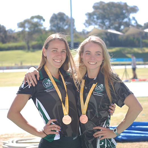 Jessica Haig and Jane Larkin with their bronze medals for athletics. 
