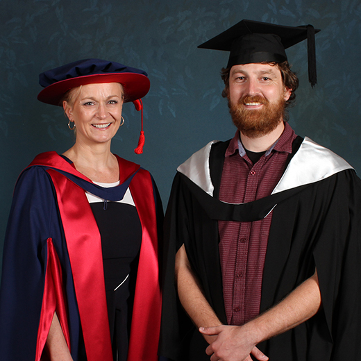 Dr Anita Hamilton congratulates University medallist Jason Carter