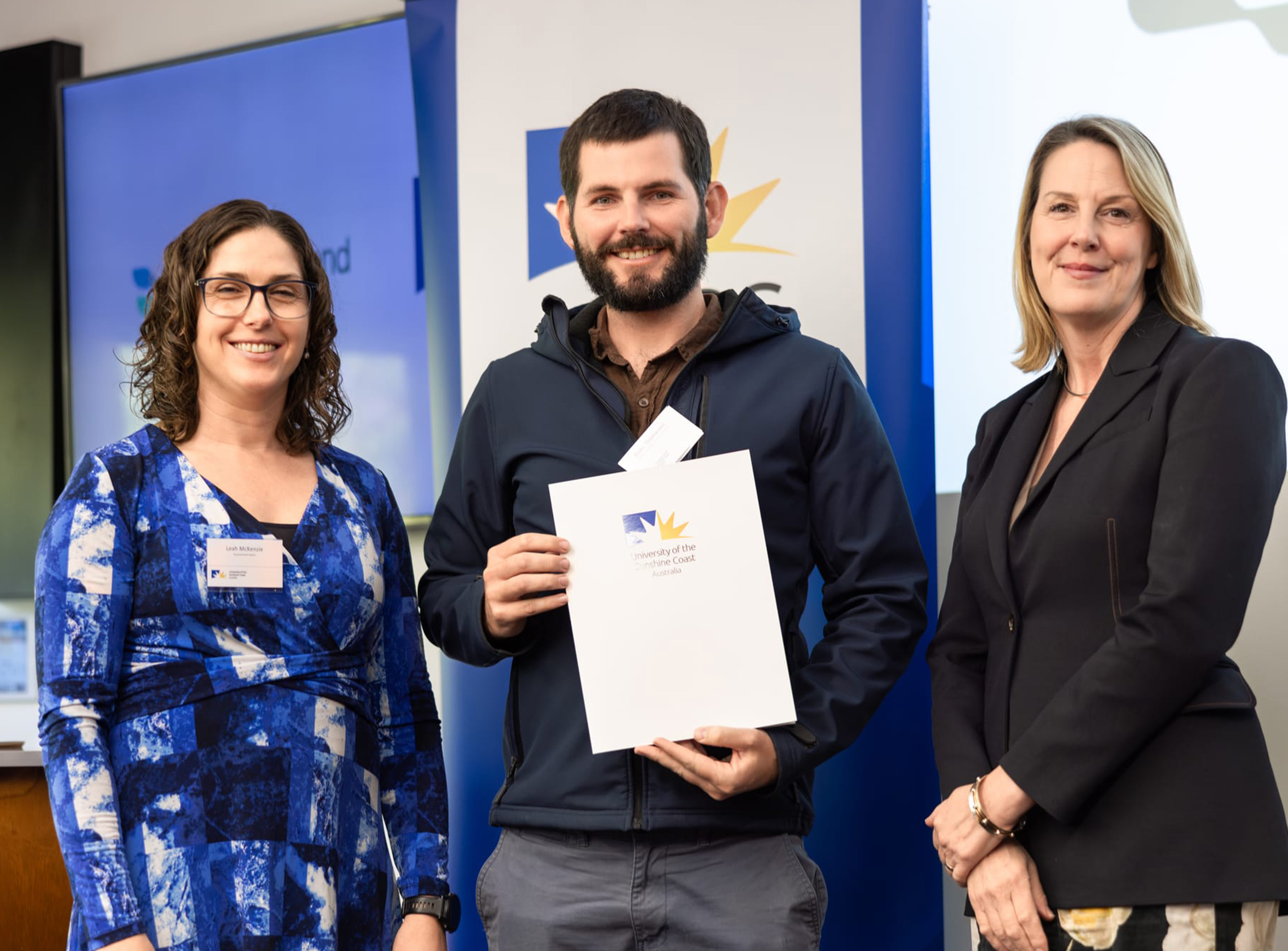 Photo (L-R): Leah McKenzie (Queensland Hydro Project Director – Borumba), Blake Thomasson and Alex Elibank Murray (UniSC Pro Vice-Chancellor, Global & Engagement) at the Queensland Hydro Scholarship award ceremony.