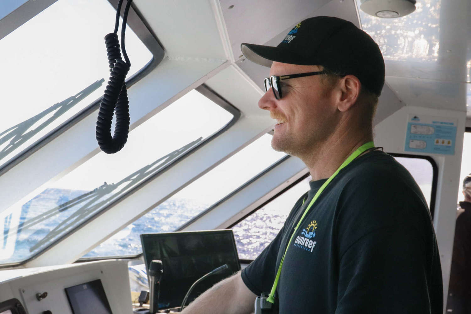 sunreef employee driving boat