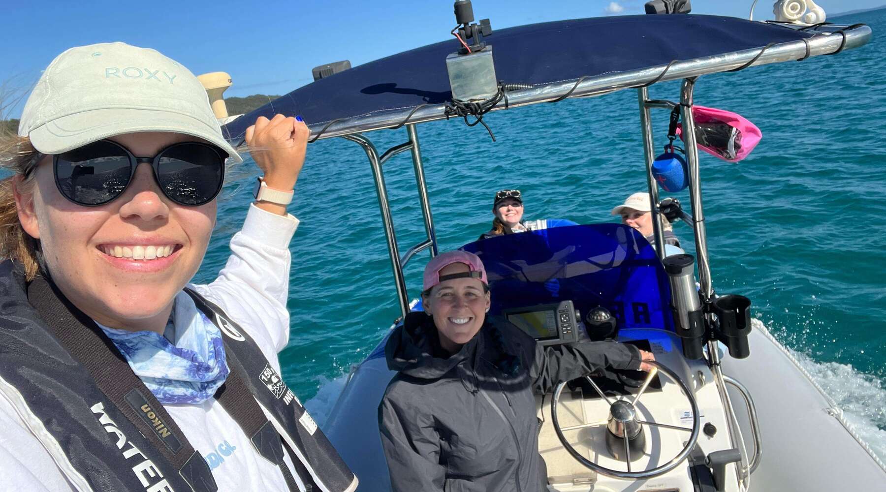 researchers on a boat