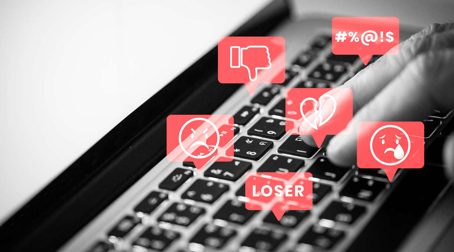 keyboard with negative emojis and the word 'loser' 